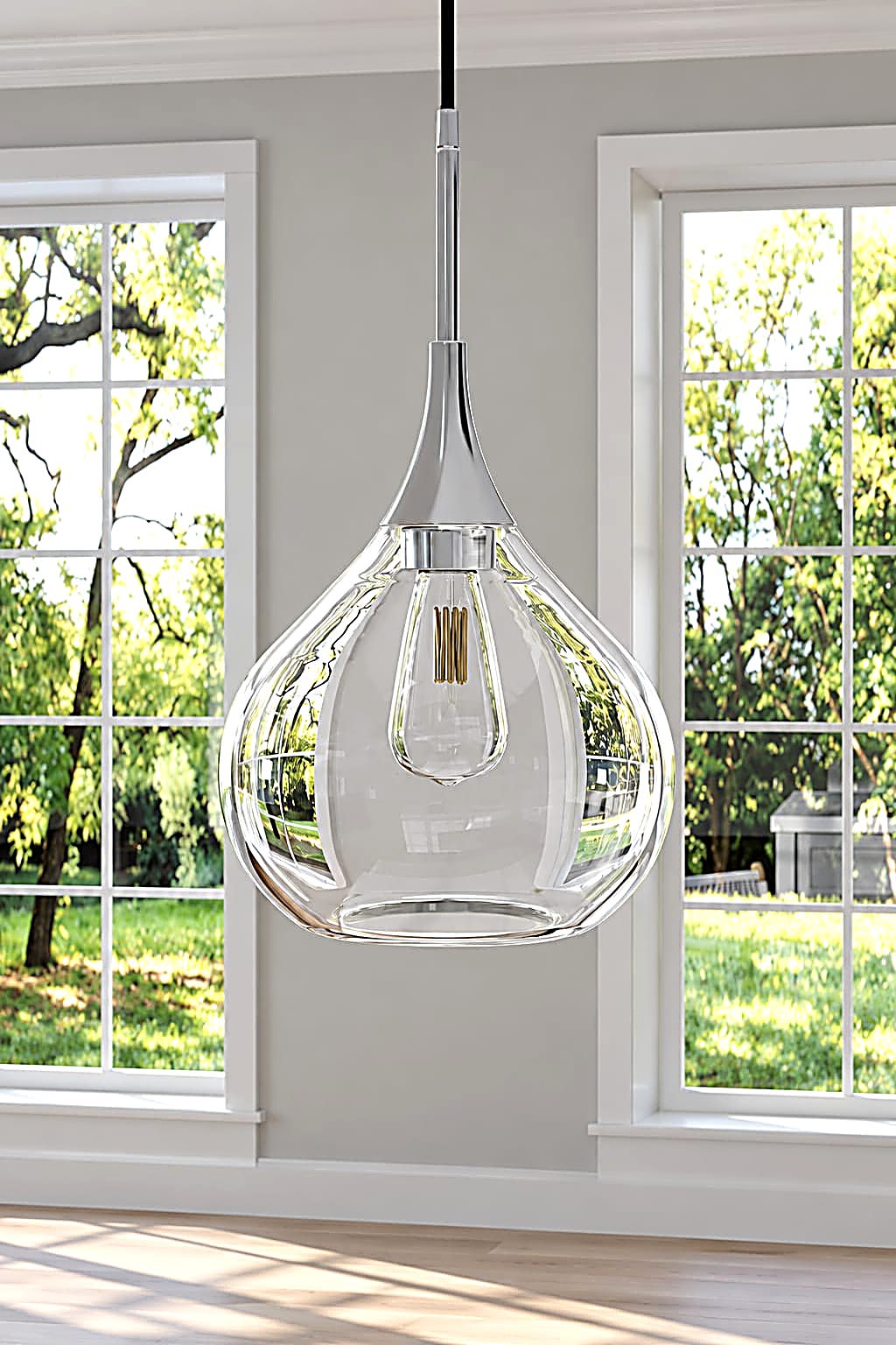 The original glass pendant light that inspired the chair's teardrop form